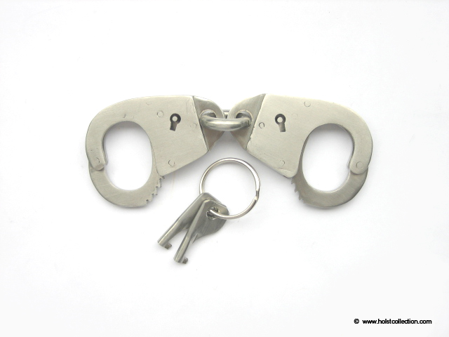 Manila thumb cuffs, smooth finish and slanted keyholes.